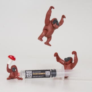 Orangutan Trading Co spore syringe with three toy orangutans playing with it, white background