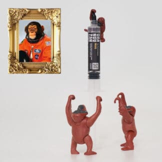 Orangutan Trading Co spore syringe with three toy orangutans playing with it, white background