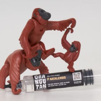 Orangutan Trading Co's P Natalensis spore syringe with three toy orangutans playing with it