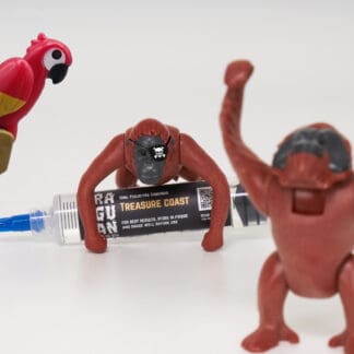 Orangutan Trading Co spore syringe with three toy orangutans playing with it, white background, and a toy parrot