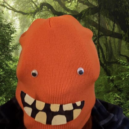 The orange beanie doubles as an orangutan mask